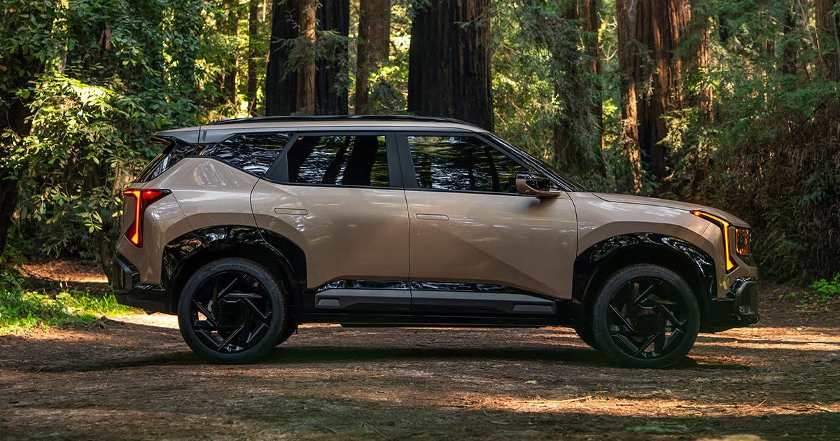 The 2027 Kia Seltos parked off-road in nature.