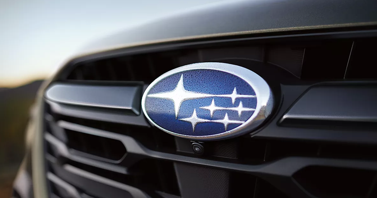 Close-up of the Subaru logo emblem on the grill of a Subaru vehicle