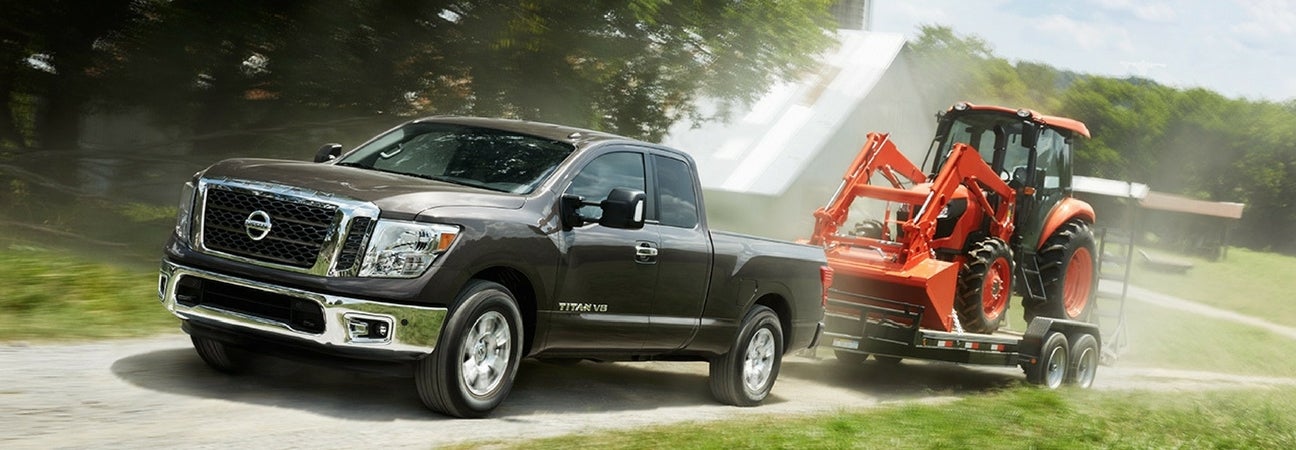 2018 Nissan Titan towing a machine