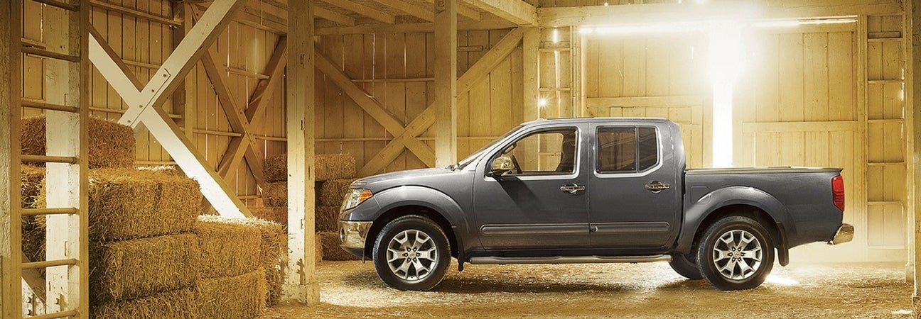 A 2018 Nissan Frontier parked inside of a barn