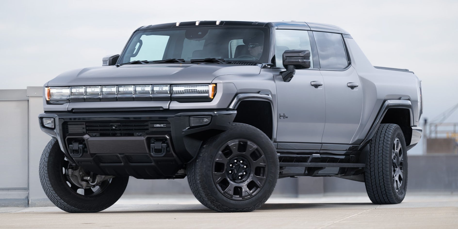 A silver GMC Hummer EV on display.