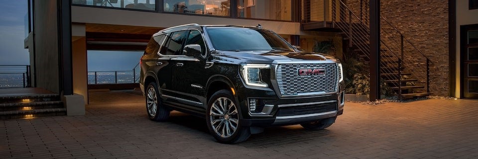 New 2024 Yukon Denali parked in a driveway