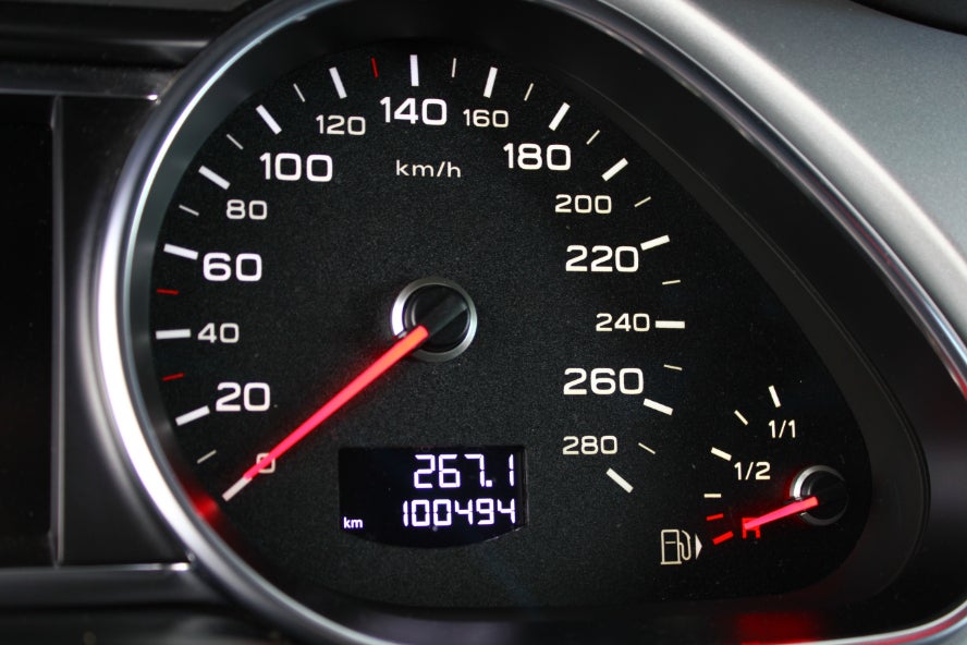 A vehicle's odometer on the dashboard.