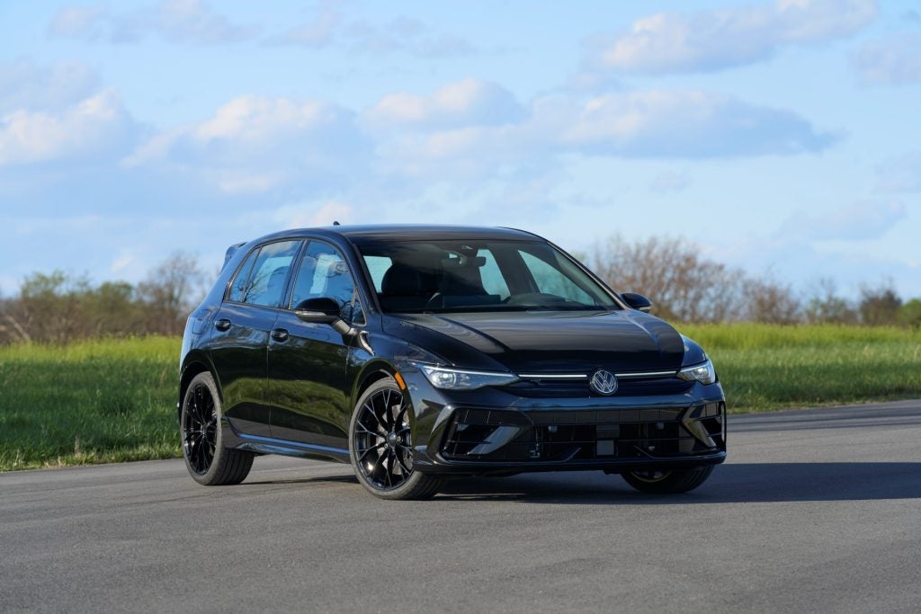 The Spectacular VW Golf R, Parked On A Concrete Pad Near A Pleasurable Field Of Grass