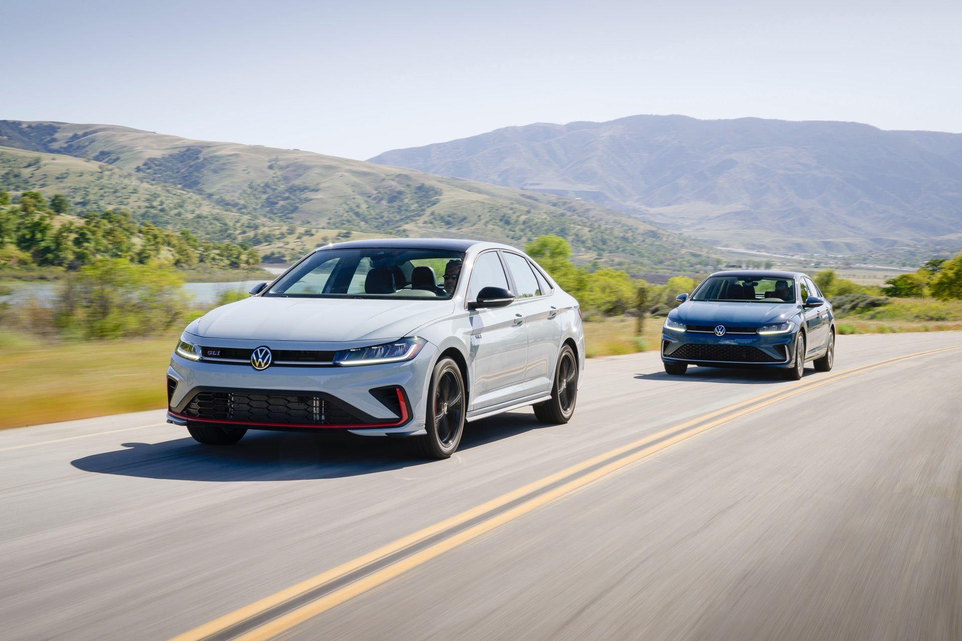 The Efficient and 2026 Volkswagen Jetta GLI and Jetta, Driving In View Of Vast Mountains and Gorgeous Greenery