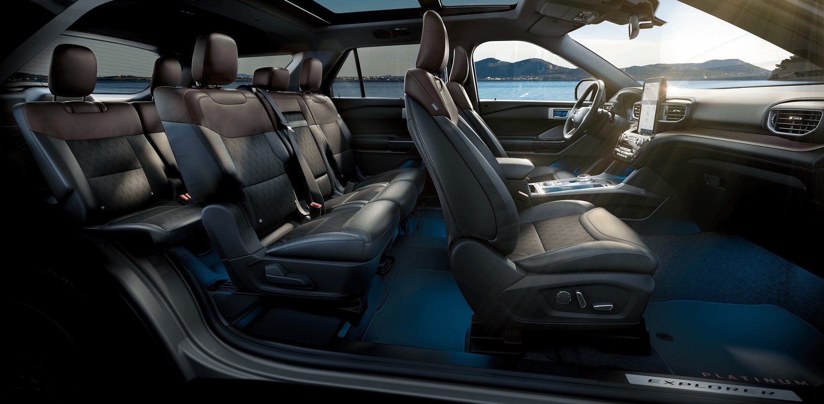 The 2021 Ford Explorer's interior pictured from the side with all three rows of leather seats.