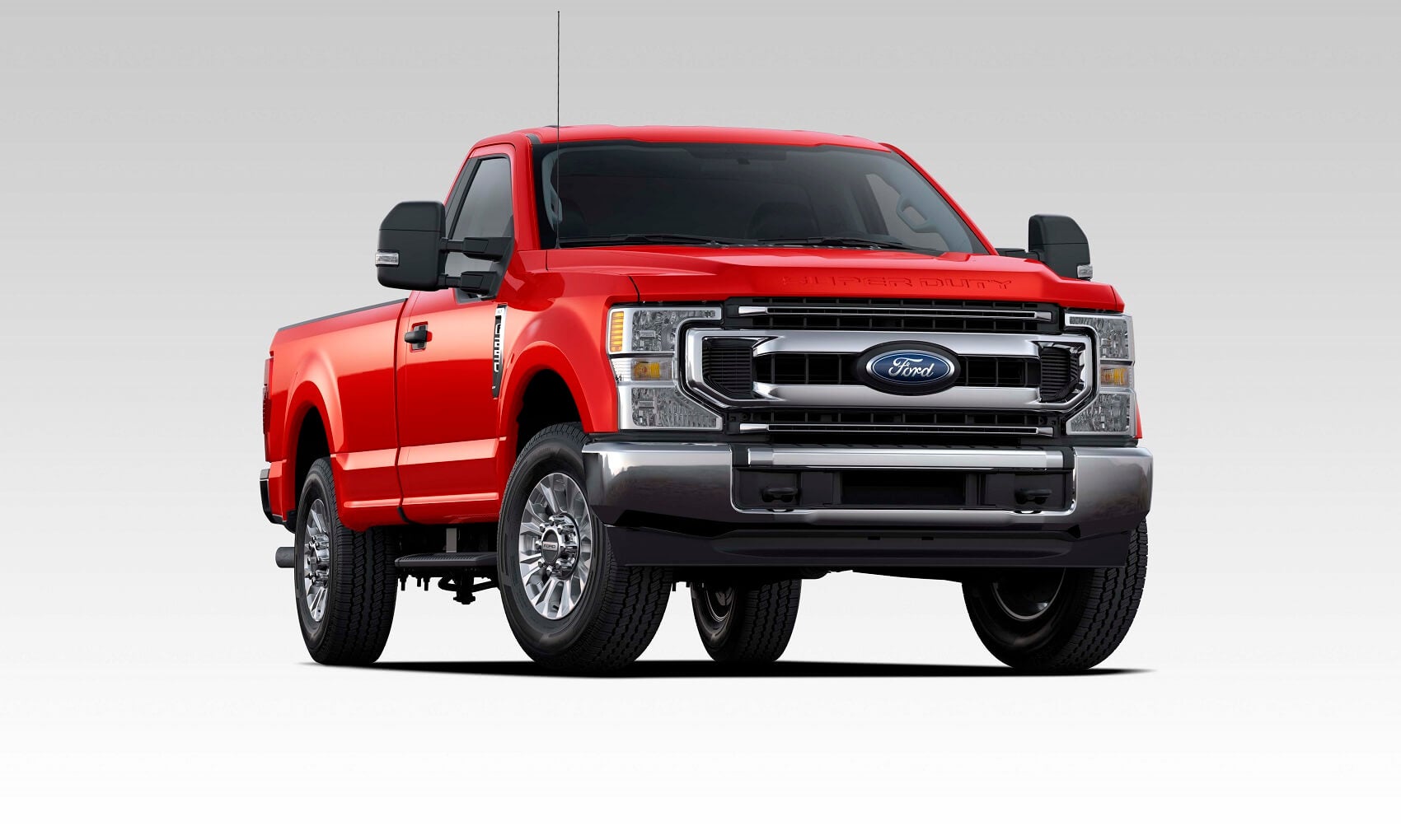 New Red 2021 Ford Super Duty F-250 against a grey and white gradient background.