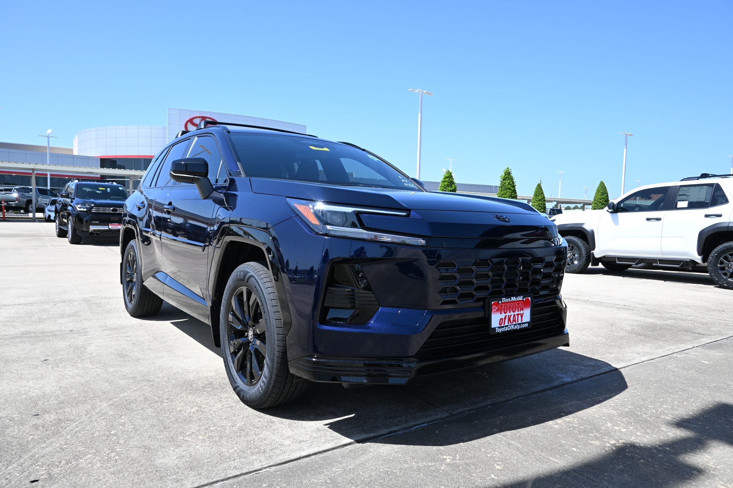 A dark blue Toyota RAV4 on the Toyota of Katy dealership lot