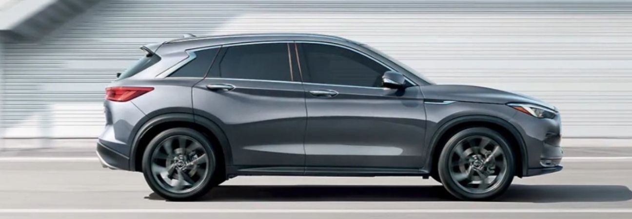 An INFINITI QX50 driving down the street