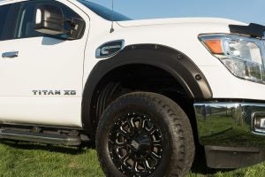 white 2019 nissan titan xd with black wheels