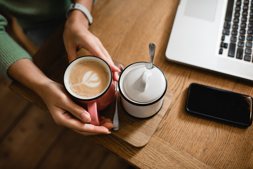 Person holding coffee mug