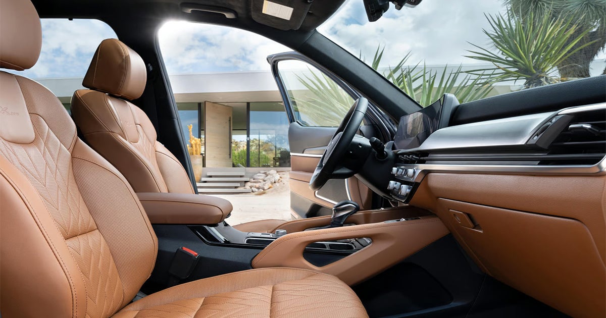 Kia Telluride luxury interior with tan leather seats and panoramic sunroof