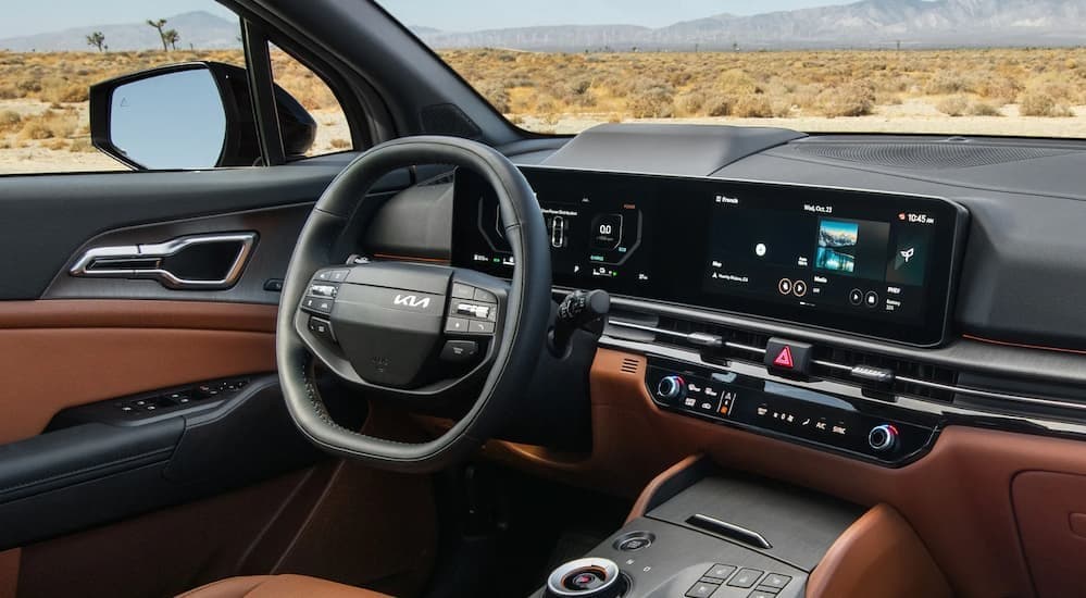 Black and brown interior and dash in a 2026 Kia Sportage SX.