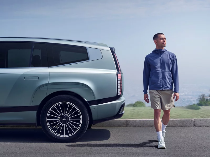 Person standing next to rear of IONIQ 9