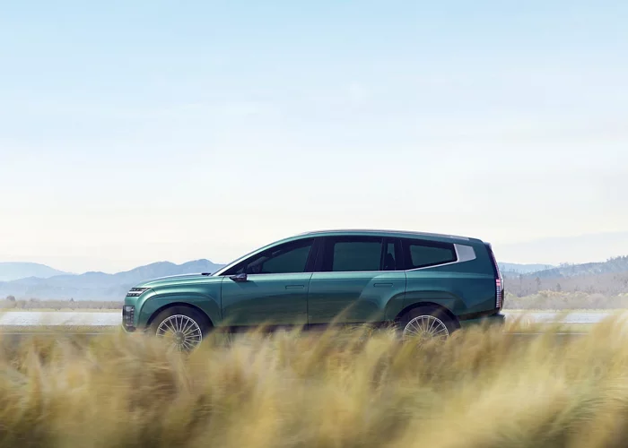 Side profile view of IONIQ 9 in grass