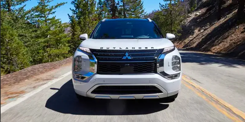 A 2025 Mitsubishi outlander driving down the road.