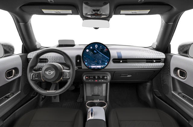 nterior view of a 2026 MINI Hardtop 2 Door featuring a round digital display, steering wheel, and modern controls.