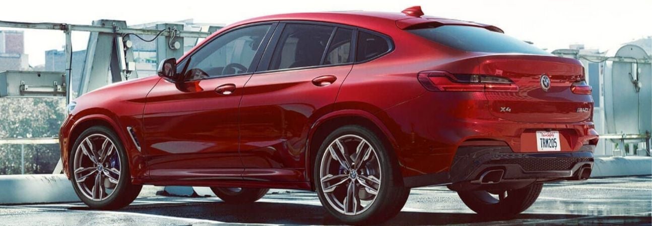2020 bmw x4 parked on top of a parking deck