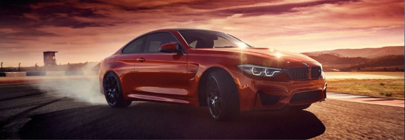 2020 BMW M4 red sedan