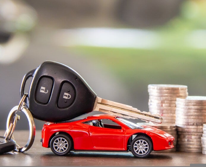 Buy vs Lease Financing Guide Customer reviewing financing paperwork at Crossroads Ford Apex