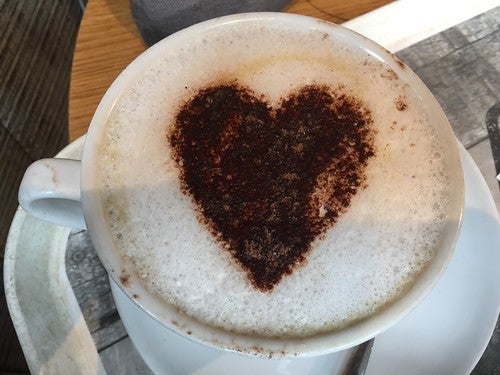 Mocha in mug with latte art heart drawn in it