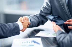 Shaking hands for loan agreement