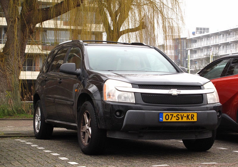 Black Chevrolet SUV backed into a parking spot