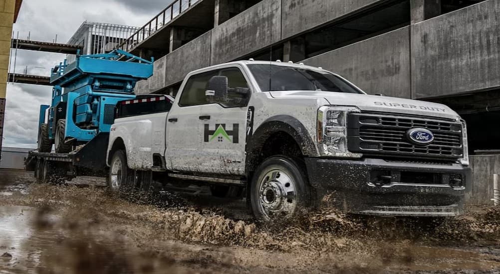 A white 2026 Ford F-350 parked on a work site.