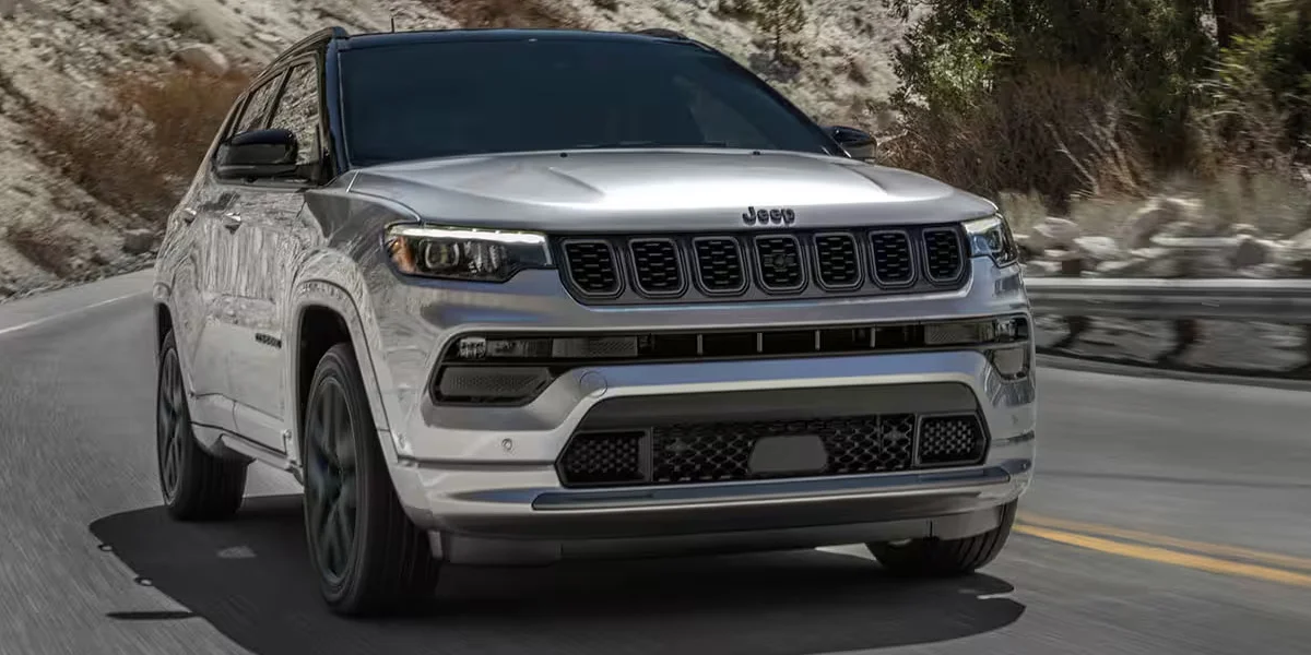 The 2025 Jeep Compass driving on a road