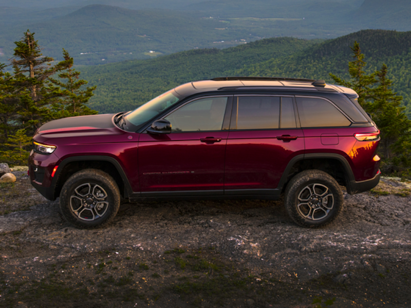 The 2024 Jeep Grand Cherokee off-roading up a mountainside