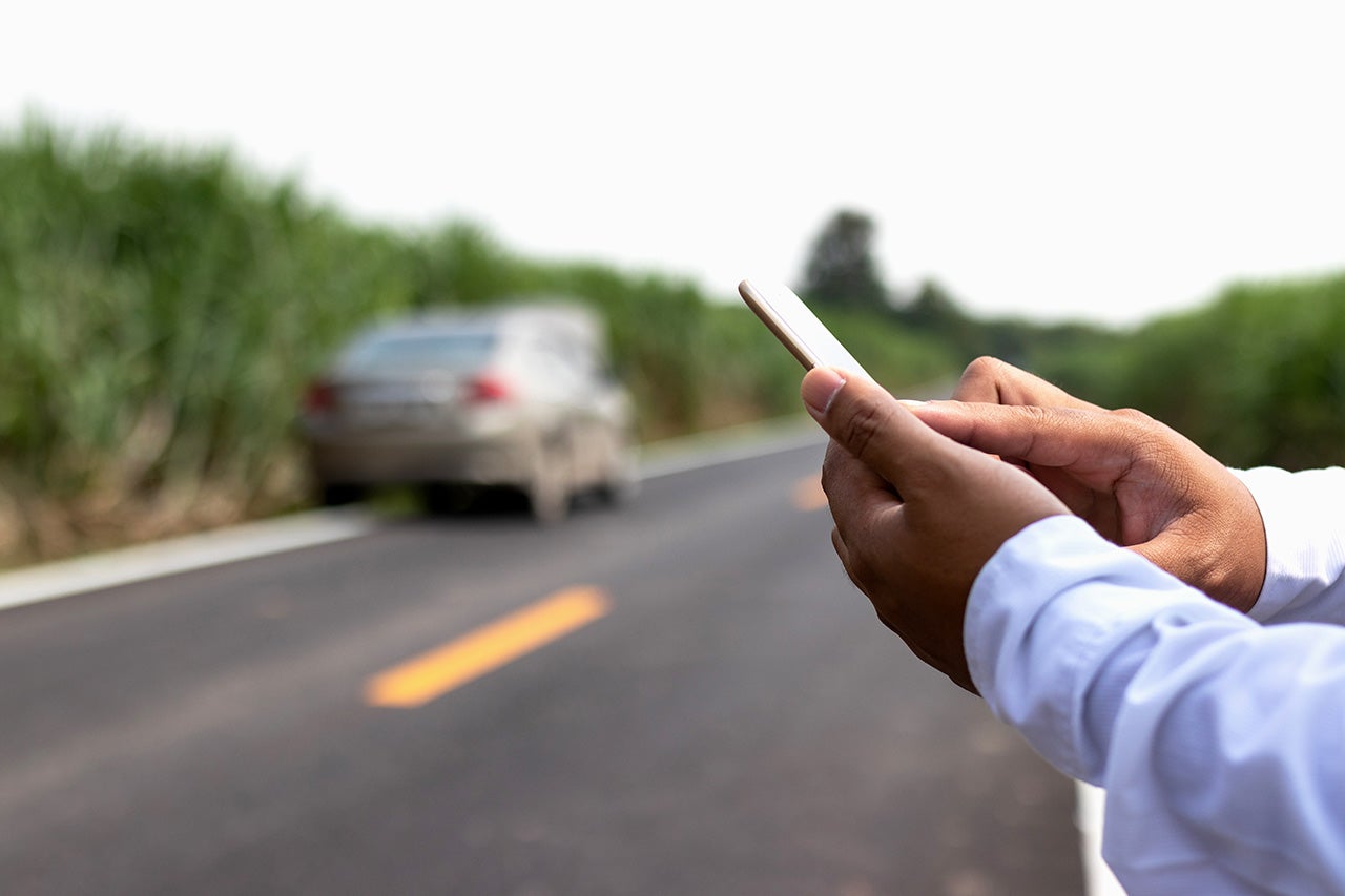 Businessman calling for assistance with his car broken. car insu