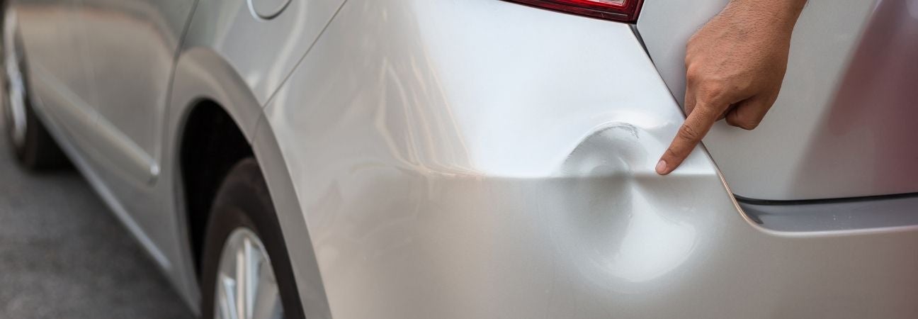 a dent in a car