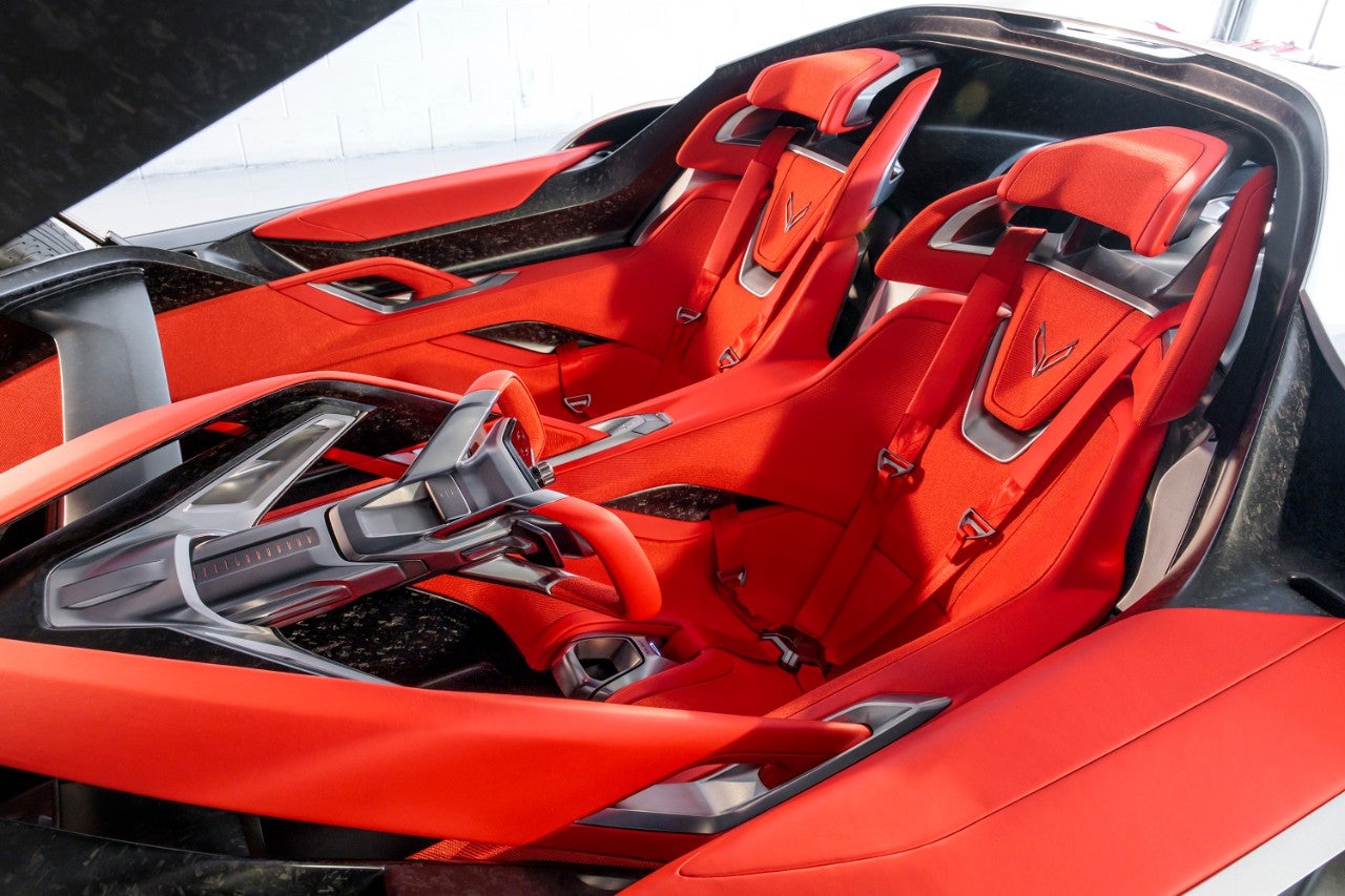 Corvette CX Concept The interior and bucket seats of a silver convertible sports car.