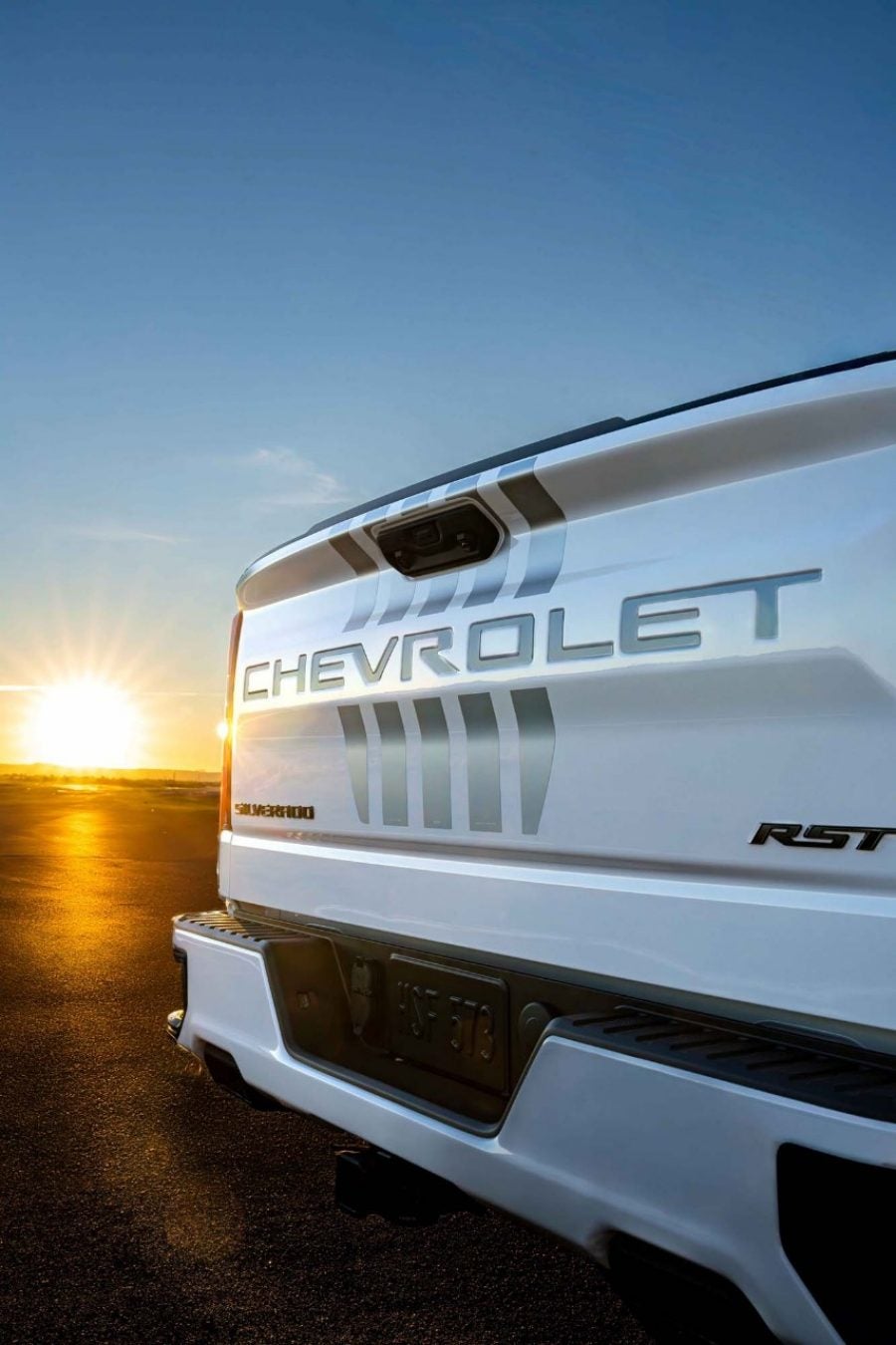 Close-up of the tailgate decals on the 2026 Silverado Stars & Steel Special Edition Tailgate of white 2026 Chevy Silverado Stars & Steel