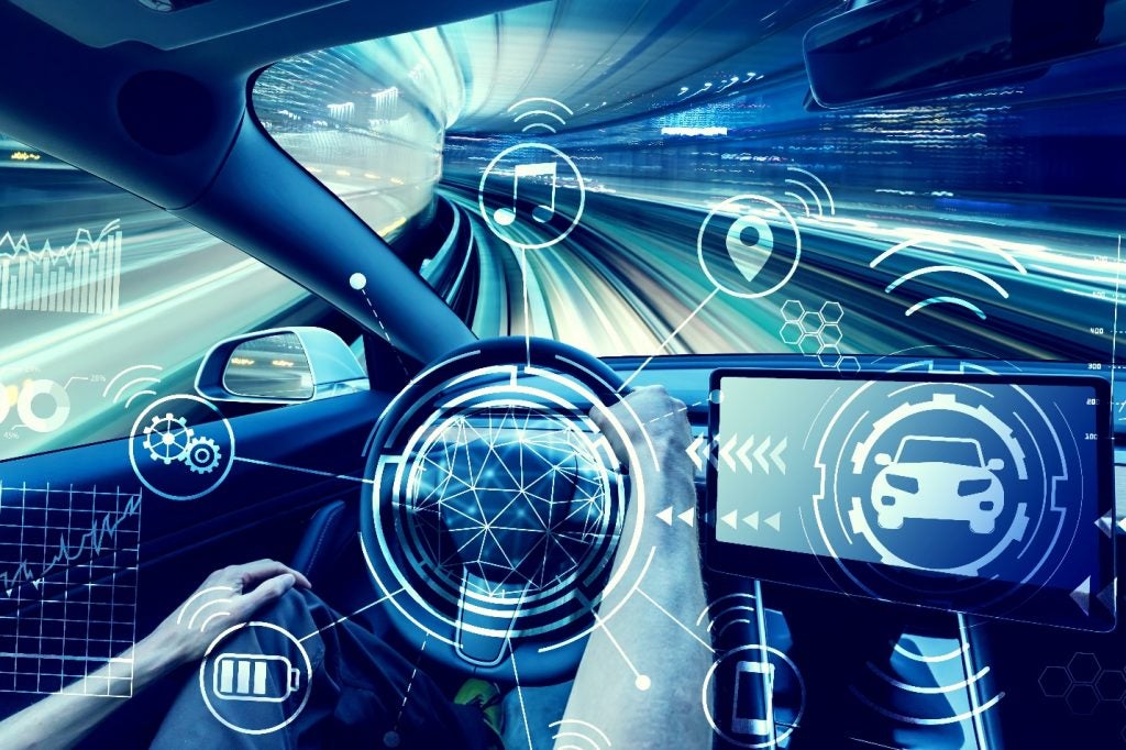 person driving a new electric vehicle from inside