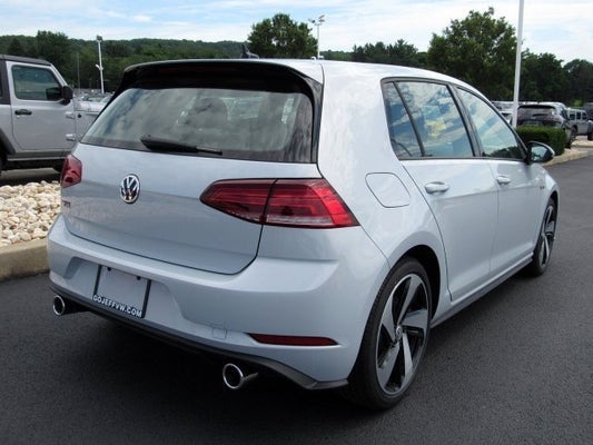 white Volkswagen Golf GTI SE