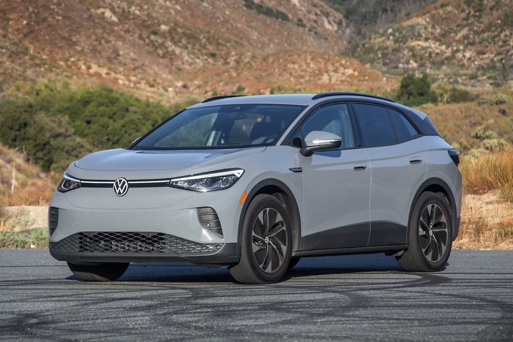 volkswagen id.4 ev parked near mountains surrounded by nature to show sustainability