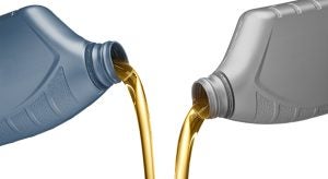 Synthetic Oil and Conventional Oil Being Poured