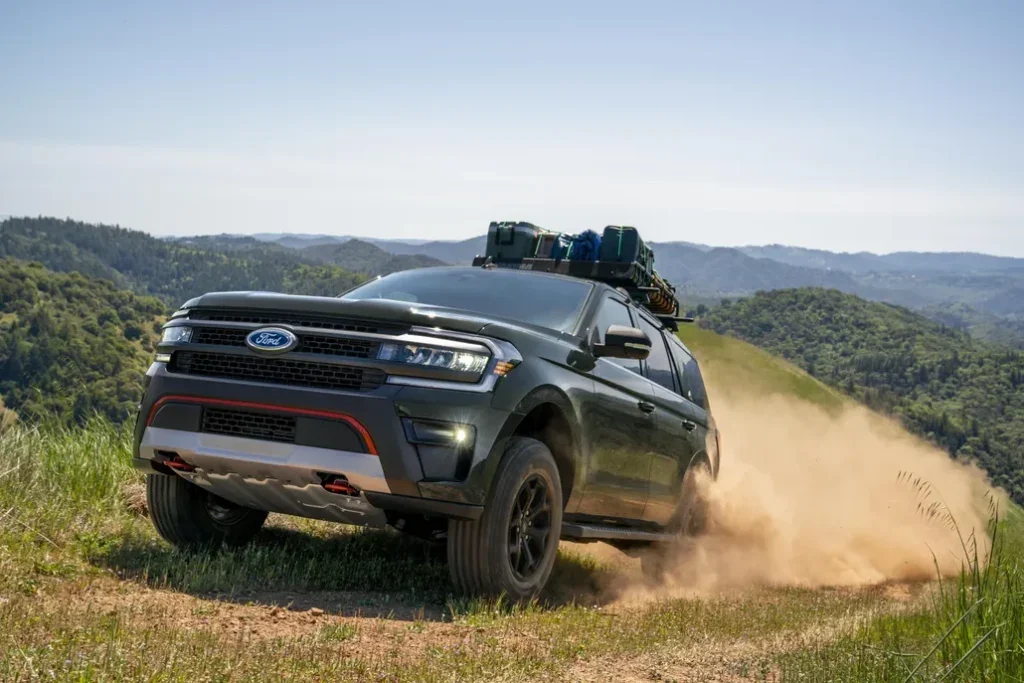 Ford Expedition Driving on a Mountain Off-Road Trail Front 3/4 View