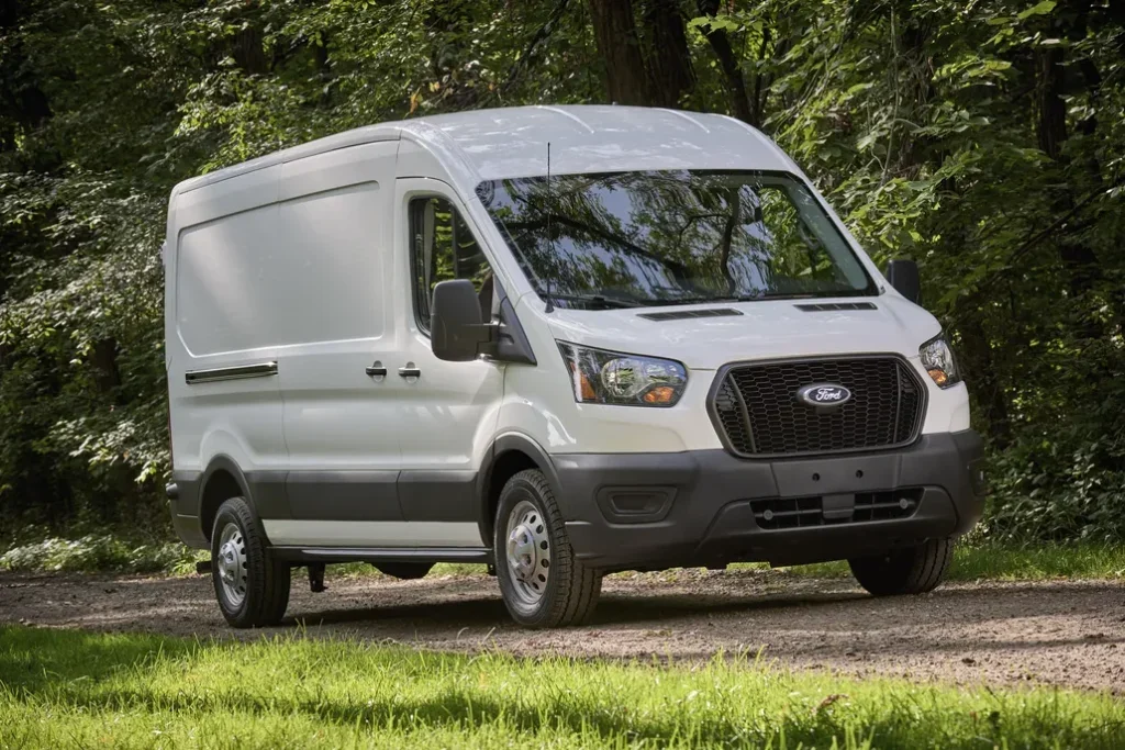 Ford E-Transit 350 Parked Front 3/4 View on a Gravel Road