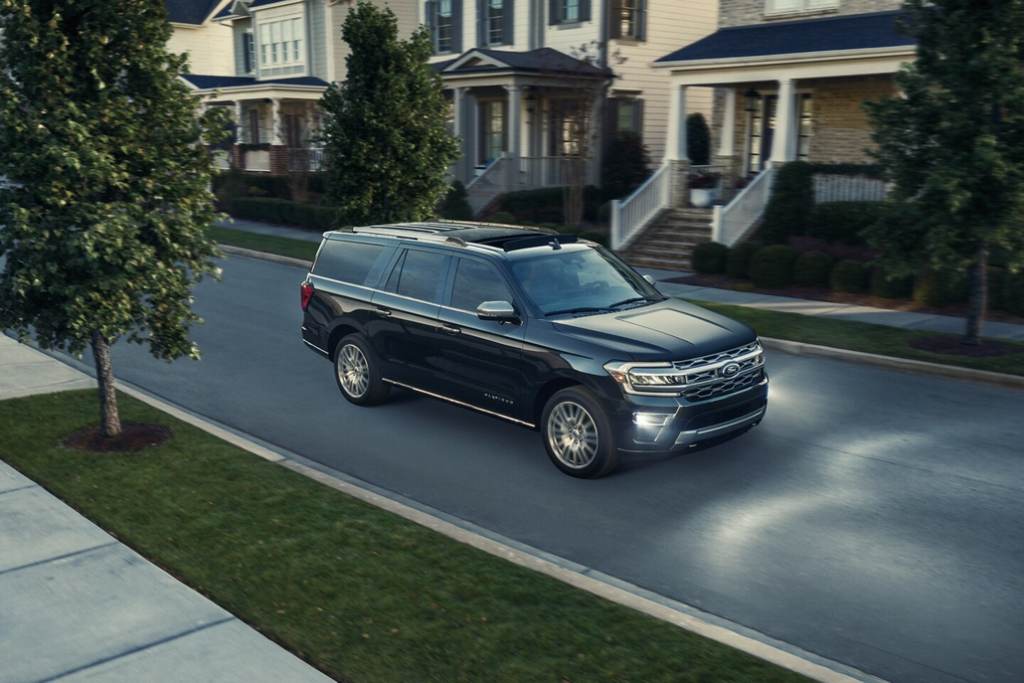 Ford Expedition Driving Through a Neighborhood Front 3/4 View
