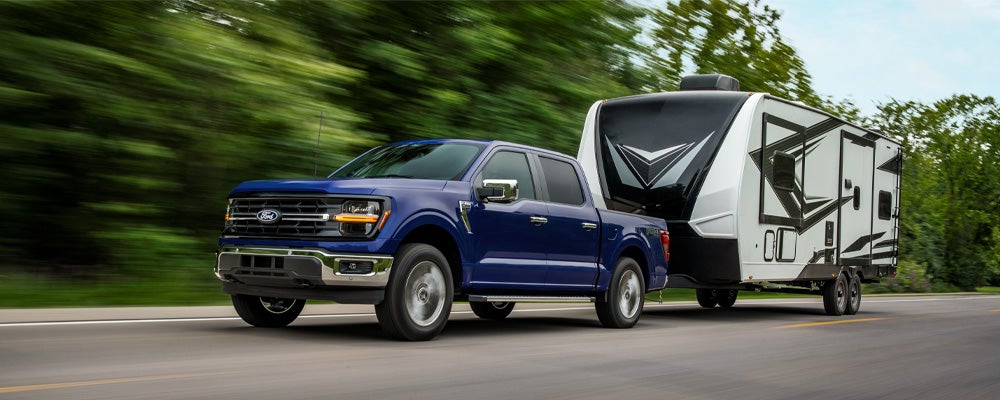 Ford F-150 towing a camper in Northern Minnesota | Best Ford Vehicle for towing