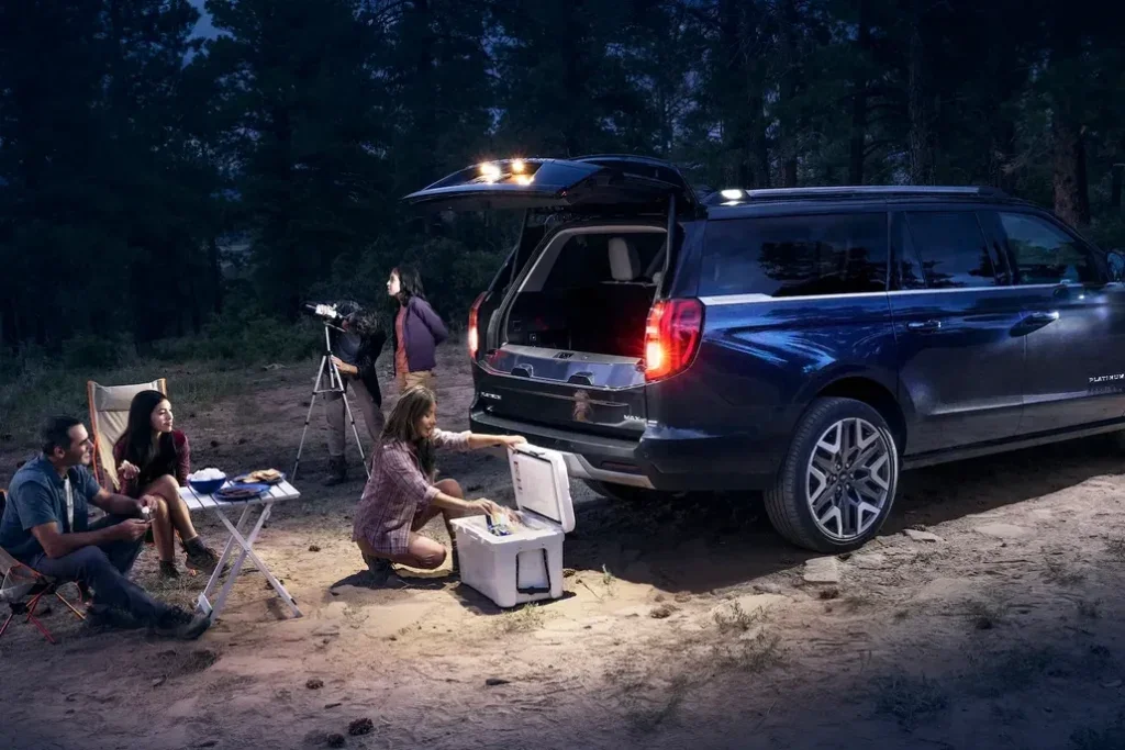 Ford Customers Using Their Ford Expedition's Multi-Zone Lighting on a Camping Trip