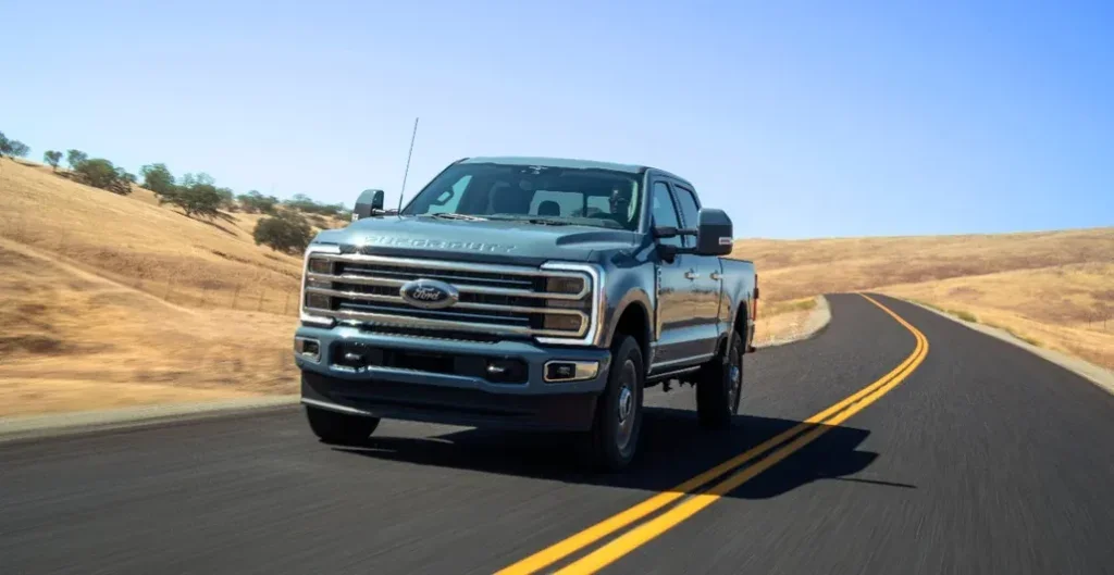 Ford Super Duty F-350 Driving on a Rural Road Front View