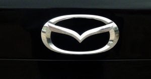 Silver Mazda symbol with black Background. | Mazda Dealer in Ellisville, MO