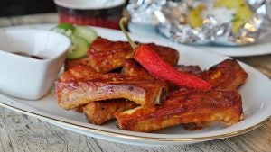 Barbecue ribs on a white plate with gold trim. | Ellisville, MO