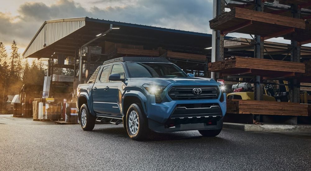 Blue Toyota Tacoma SR5 Double Cab parked in a lumber yard.