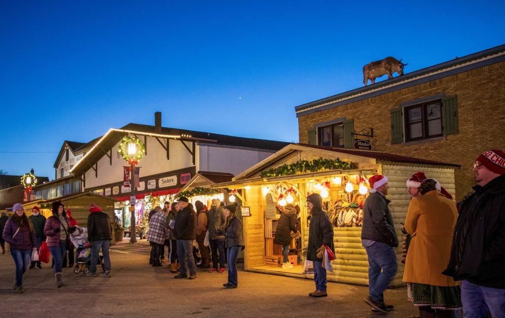 Adults shopping the streets of New Glarus Wisconsin