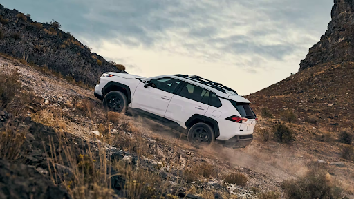 2023 Toyota RAV4 Hybrid driving uphill off-road