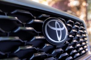 Front grill of the Corolla Cross featuring a large Toyota badge.